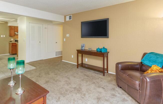 a living room filled with furniture and a tv