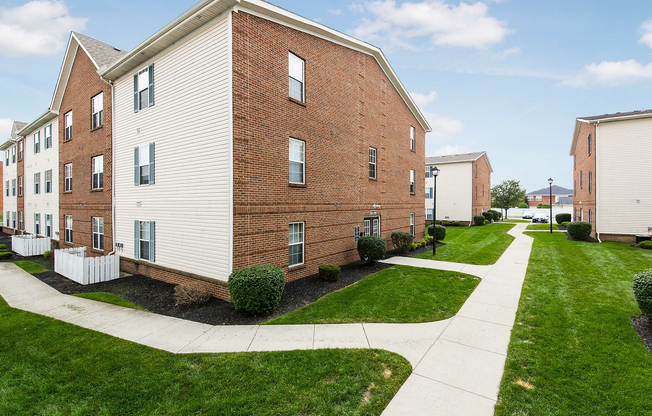 Experience serene living in these charming brick apartments surrounded by lush greenery.