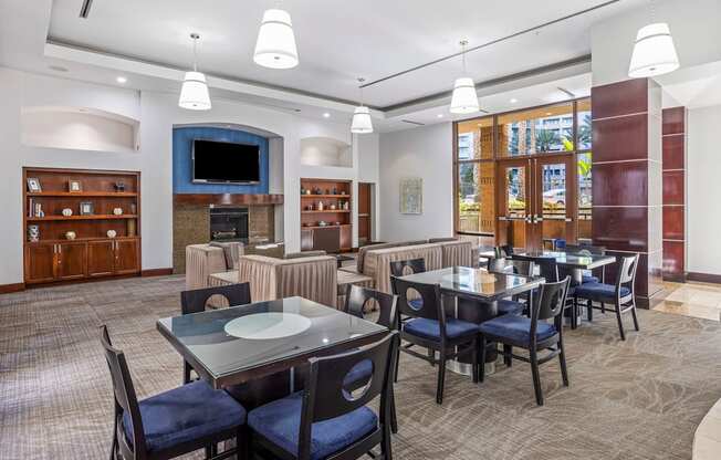 A dining room with a table set for six people.