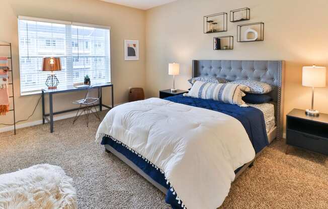 the preserve at ballantyne commons bedroom with large bed and windows