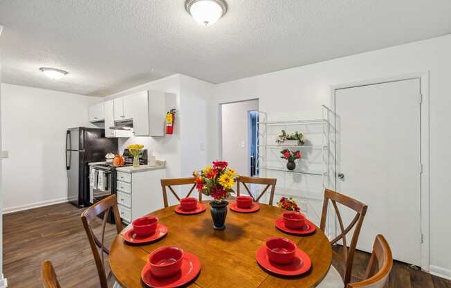 a kitchen and dining room with a table and chairs