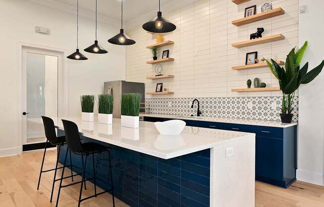 a blue and white kitchen with a white counter top at Sovereign at Overland Park, Kansas  