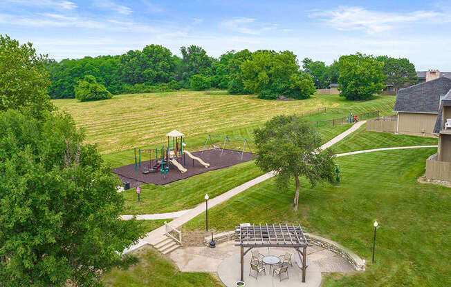 a rendering of a park with trees and a playground