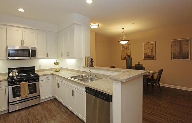 a large kitchen with stainless steel appliances