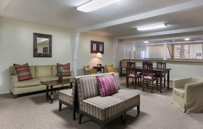 a living room with couches chairs and a table