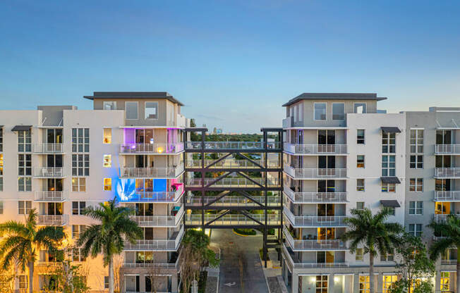 an overhead view of an apartment complex with a bridge