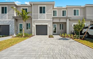 Brand new 3 bed 2.5 bath Townhouse with yard, garage and impact-resistant windows within Luxurious Community Terra Sol