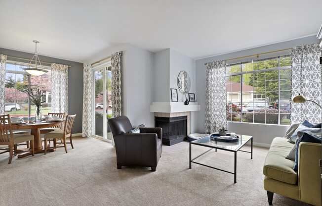 a living room with a fireplace and a table