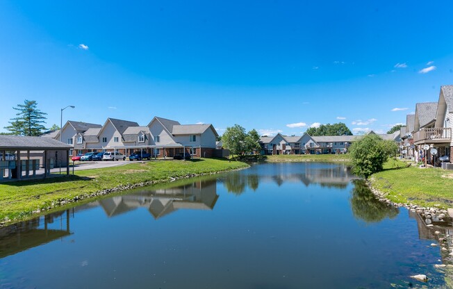 a body of water with houses on the side of it