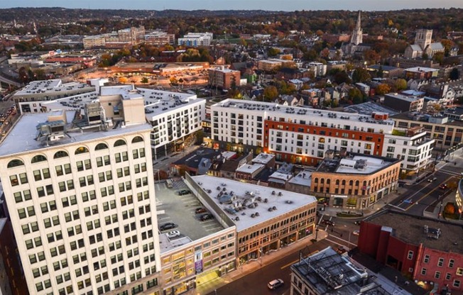 arial view of a city with a church in the background