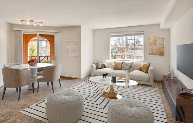 a living room with a white couch and a white coffee table with two ottomans  at Falcon Bridge at Gale Ranch, San Ramon, 94582