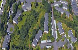 an aerial view of a neighborhood with houses and trees