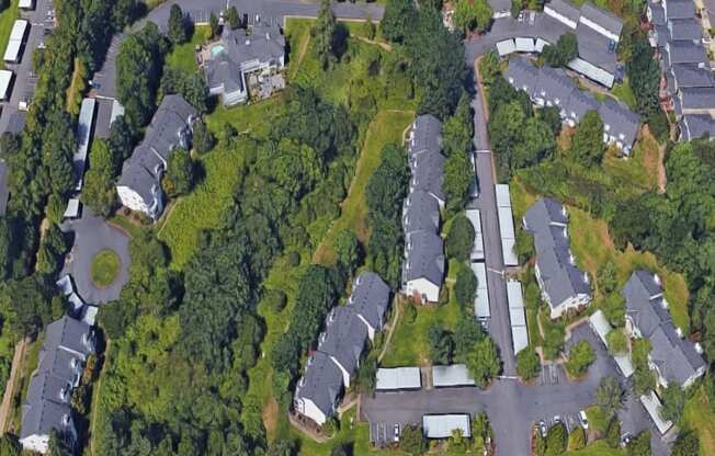 an aerial view of a neighborhood with houses and trees