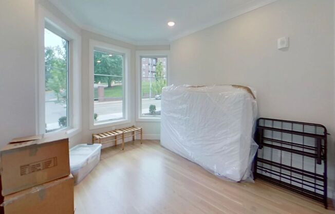 Steps from The T Stop. High-End Amenities. Central AC, In Unit Washer/Dryer