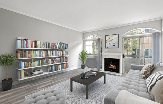 Large living room featuring hardwood floors and natural light providing adjacent patio.