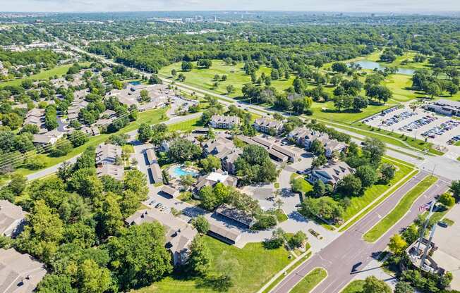an aerial view of a neighborhood with houses and trees