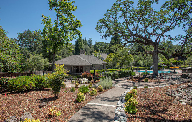 A clubhouse with a garden in front of it at Rocklin Gold Apartments, California, 95677