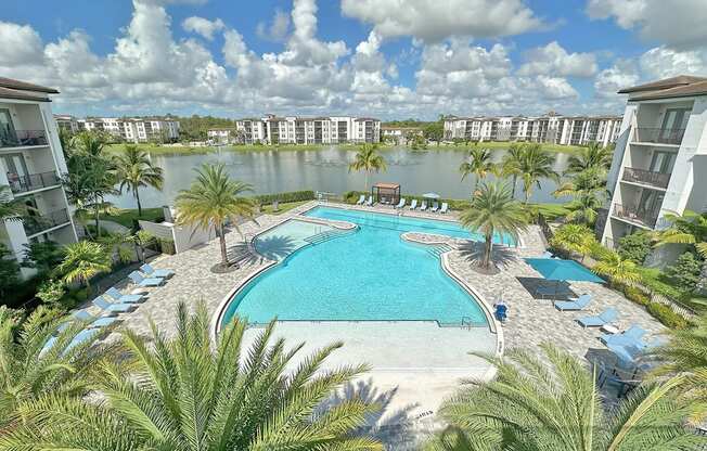 Heated pool with swim lane, cabanas, sun shelves and WiFi overlooking private lake