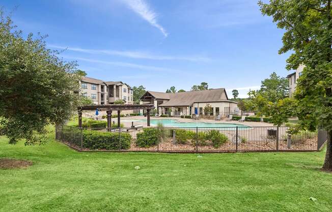 A large house with a pool in the backyard.