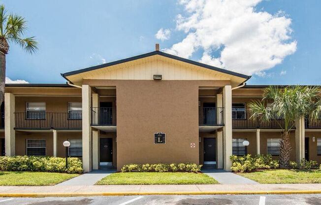 a building with palm trees in front of it