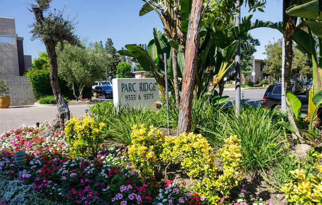 a park ridge sign in a garden of flowers