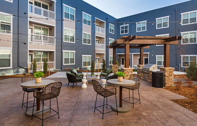 Outdoor BBQ Picnic Tables at CO Springs Apartments Near Seven Bridges Trail