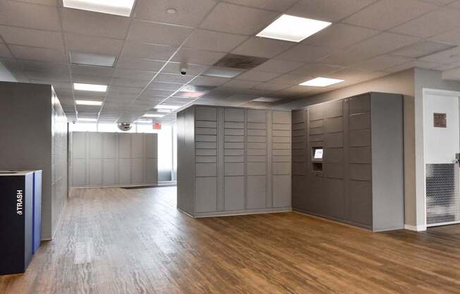 A room with wooden floors and grey walls.