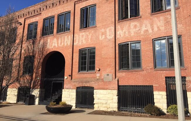 a brick building with a sign on the side of it