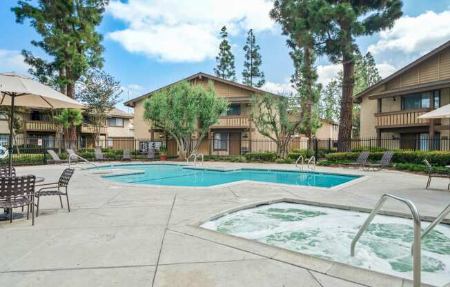 our apartments have a swimming pool and a patio with chairs