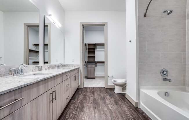 The Crosby at The Brickyard large bathroom with wooden floors Dallas Texas Apartment