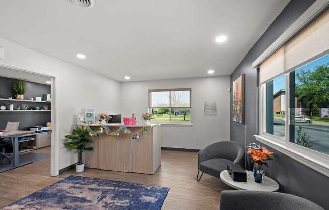 A reception area with a desk and chairs.