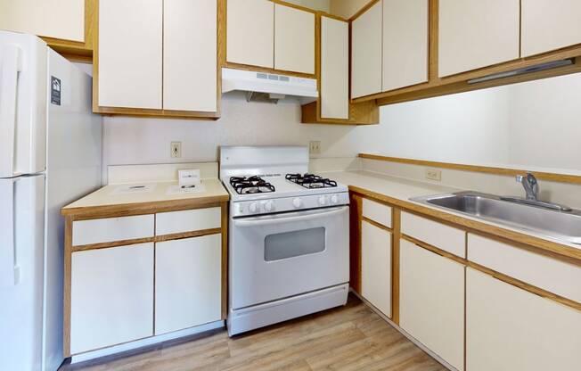 a kitchen with white appliances and breakfast bar