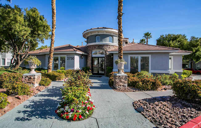 A clubhouse exterior with landscaping in front. at Octave Apartments, Las Vegas, 89123