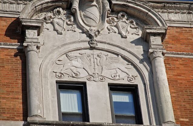 an ornate window on the side of a building