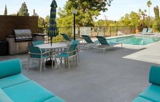 our apartments have a pool and a patio with furniture