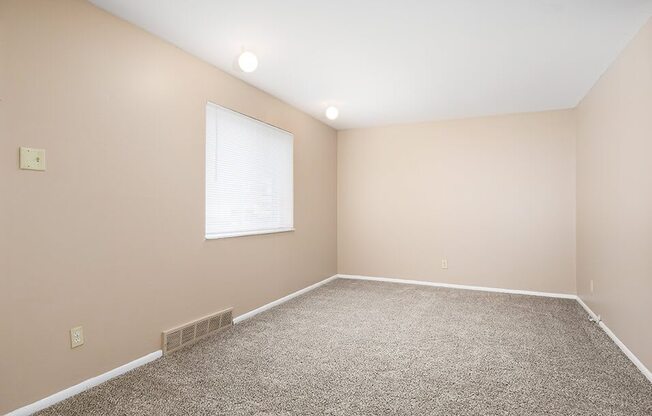 carpeted bedrooms at Emerald Crossing Apartments