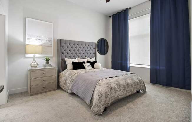 a bedroom with a bed and a dresser at 200 City View, Provo, 84601