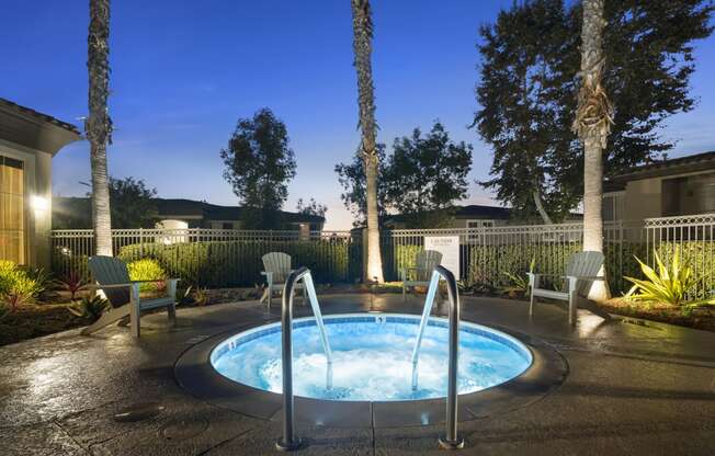 Estancia at Mission Grove Apartments Hot Tub at night