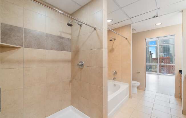 a large bathroom with a shower and a tub in it