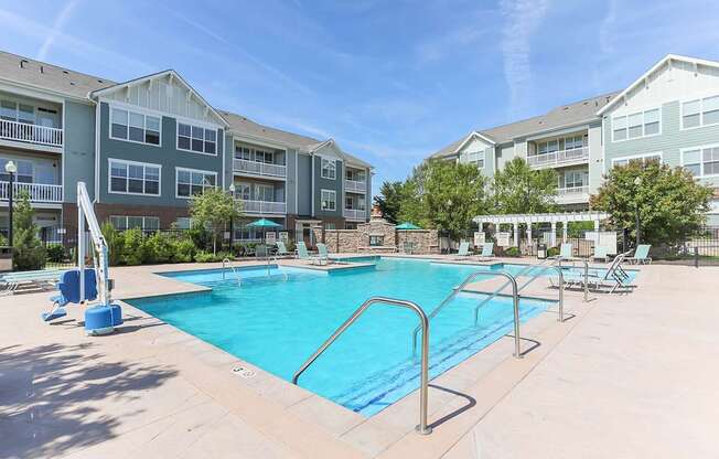 Resort-style pool with sundeck at Aventine Wilderness Hills in Lincoln, NE