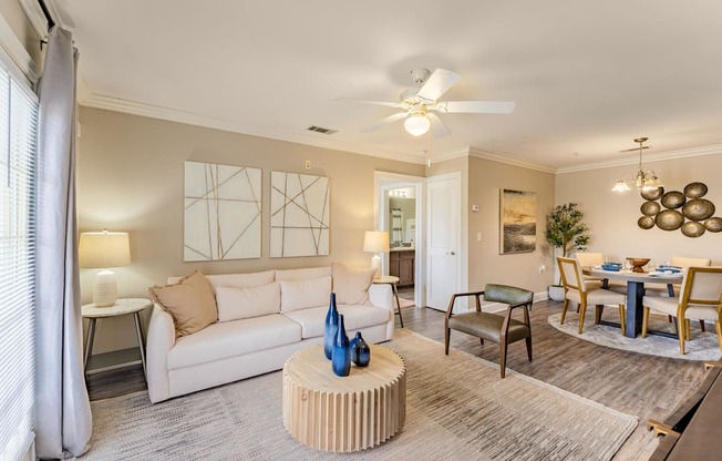 a living room with a white couch and a table