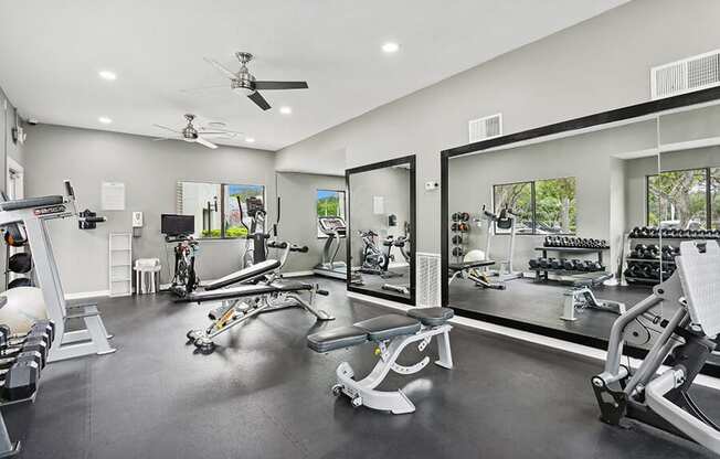 Community Fitness Center with Equipment at Huntington Place Apartments located in Sarasota, FL.