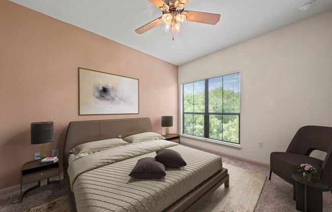 a bedroom with a bed and a ceiling fan