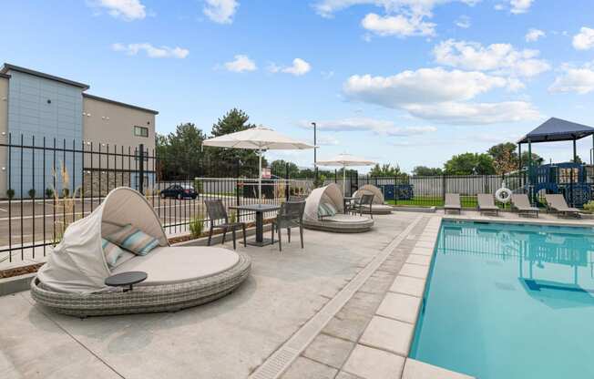 our apartments have a resort style pool with lounge chairs and umbrellas