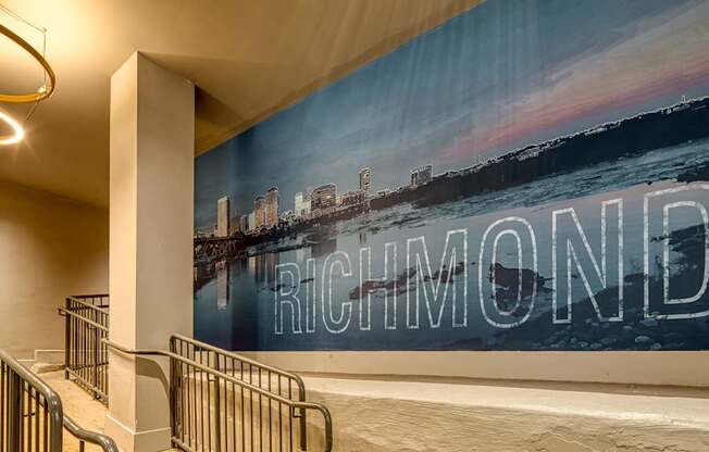 A mural of Richmond is displayed on a wall in a building.