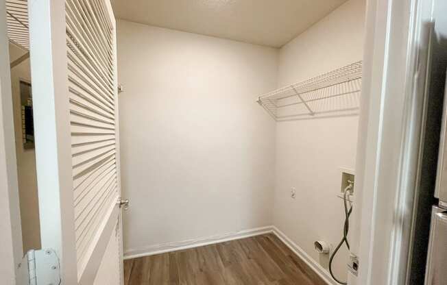 The Crest at Berkeley Lake St James laundry closet with appliance hookups located in Duluth, GA 30096