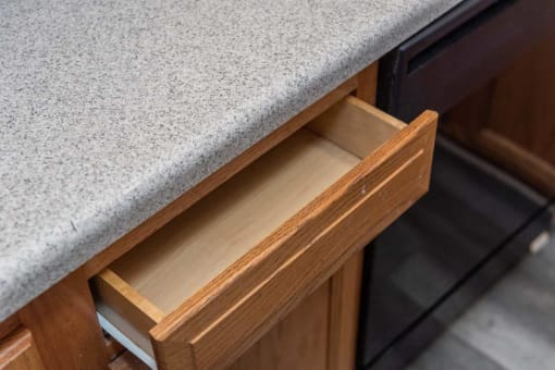 a close up of a kitchen counter with drawers