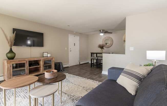 This is picture of the living room and dining area in the 823 square foot 2 bedroom apartment at Aspen Village Apartments in the Westwood neighborhood of Cincinnati, OH.