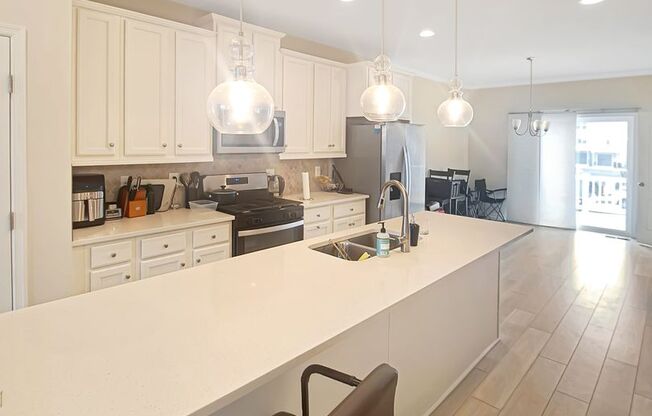 Modern New Construction 3-Level Townhome w/3 Bedrooms, 3.5 Bathrooms, Gourmet Kitchen, LVP Flooring, 2-Car Garage, Deck and More!