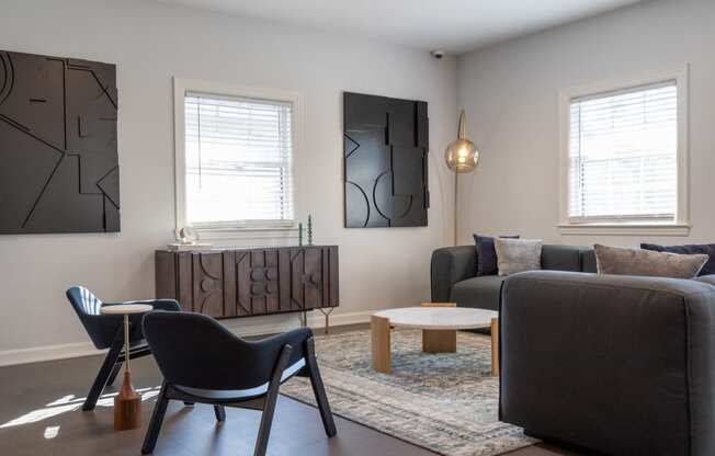 a living room with a couch and a table and chairs